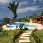 Swimming pool and beautiful gardens of this malpais rental villa